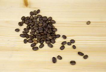 Scattered coffee beans on table