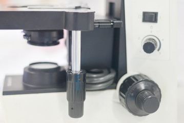 blurred sterio microscope in biology laboratory in white