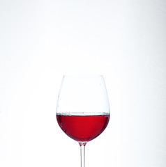 A glass of red wine. The concept of alcohol and party.