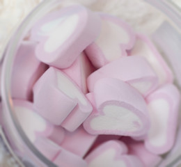 Marshmallow in heart-shaped pink color in a dose