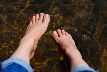 Soak the foot in the  river.
