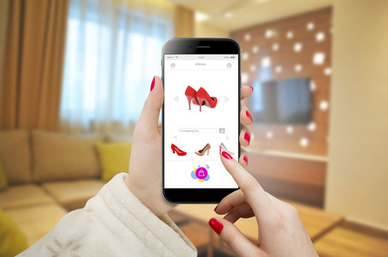 Women searching and ordering shoes online.  Online shopping with smartphone