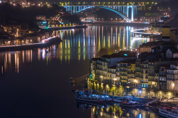night cityscape view city of Porto and Douro river in Portugal