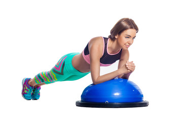 Woman doing exercises on the bosu abdominal muscles. Isolated