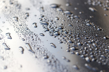 drops of water on a dark car