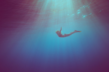 girl dive underwater