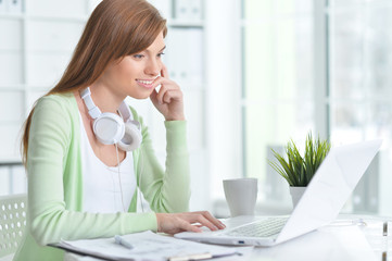 Beautiful girl working at a laptop