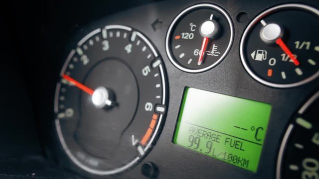 Close up image of a car's dashboard indicating a very high fuel consumption.