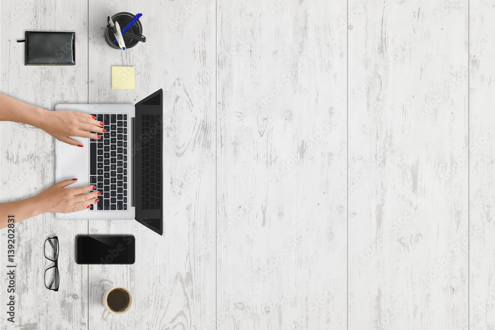 Poster modern laptop and mobile phone on office desk with free space for text. white wooden texture in back