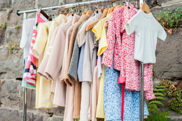 The collection spring-autumn clothes for girls on hangers