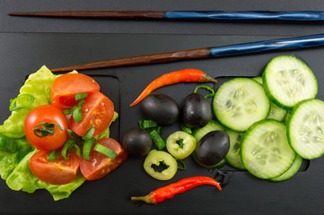 chopsticks and vegetables