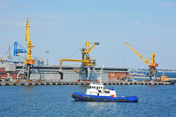Tugboat and port cargo crane