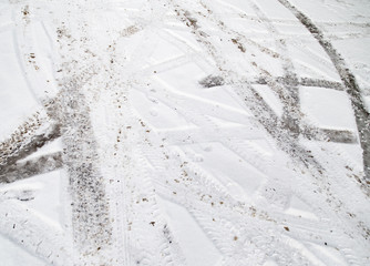 traces of cars on the road in winter