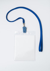 Lanyard and badge. Conference badge. Blank badge template in plastic holder with blue strap.