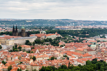 Top view to old town, historical districts and red roofs of Prague, Czech republic from an...