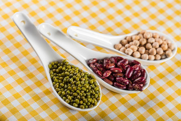 mix of beans on wooden table