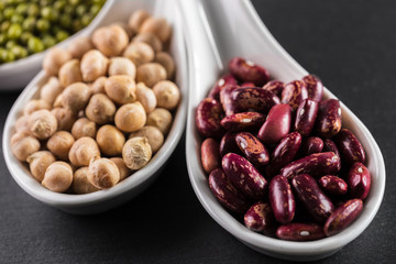 mix of beans on wooden table