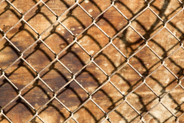 metal mesh on the wood background