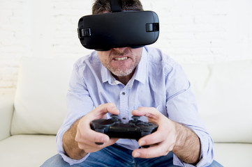 man at home living room sofa couch excited using 3d goggles play
