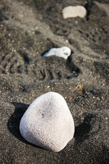 Fototapeta na wymiar White gravel, black sand, bokeh, blurred backdrop