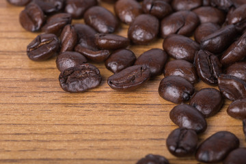 Coffee beans on wood background