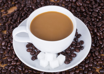 Coffee cup with sugar and beans