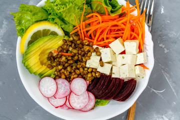 Vegan Buddha bowl - beets, tofu, mung bean, carrot and avocado. Love for a healthy vegan food concept