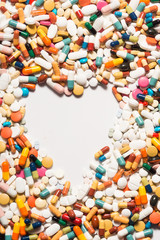 Multiple pills depicting medical treatment or pahrmaceutical industry. High resolution image.