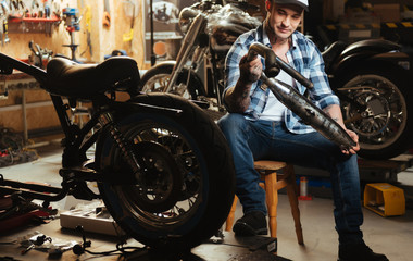 Happy young master wearing checked shirt