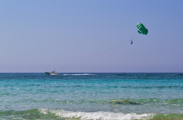 Parasailing in the blue sky, Cyprus.