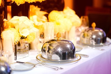Beautiful table setting with crockery and flowers for a party, wedding reception or other festive event