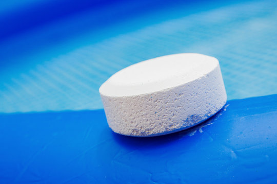 Chlorine Pellets on the edge of an inflatable pool