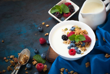 Greek yogurt with granola and fresh berries. Healthy food.