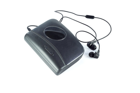 Cassette player and black earphones isolated