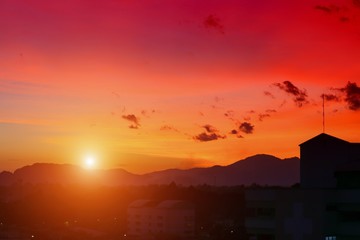 sky day red sunset  and  beautiful colorful evening nature landscape twilight time with city silhouette