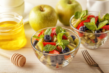 Healthy homemade fruit salad with honey.