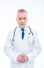 Mature doctor with stethoscope