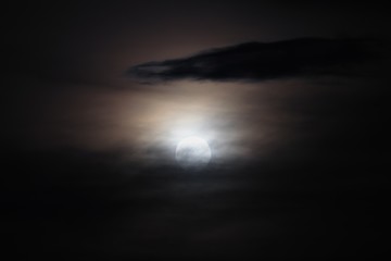Full moon beautiful over dark black sky at have raincloud in night