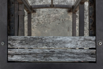 Old weathered wooden chair planking texture. Wood slats grungy with steel frame background