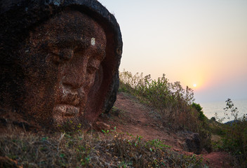 Stone Buddha Head at the mountain near Gokarna