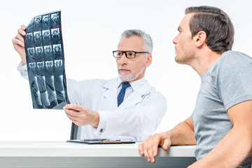 Doctor shows x-ray image