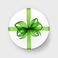 White Round Gift Box with Transparent Light Green Bow and Ribbon Top View Close up Isolated on Background