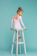 The little balerina dancer on blue background © master1305