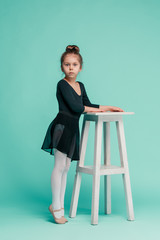 The little balerina dancer on blue background © master1305