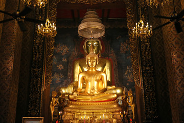 Beautiful of golden Buddha statue and thai art architecture in Wat Bovoranives, Bangkok, Thailand.