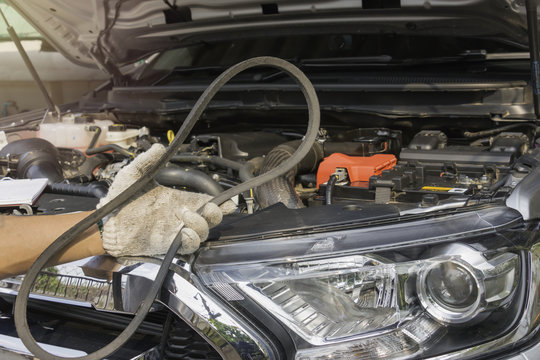 Car Mechanic Replacing Timing Belt