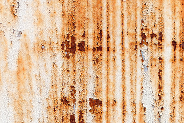 A background of peeling paint and rusty old metal