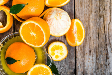Squeezed orange juice and fresh oranges fruits, flat lay, overhe