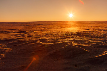 Martian sunset (Mars planet) red landscape. Looks like cold desert on Mars. A huge field of ice