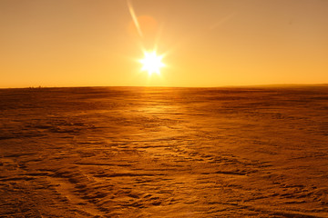 Martian sunset (Mars planet) red landscape. Looks like cold desert on Mars. A huge field of ice